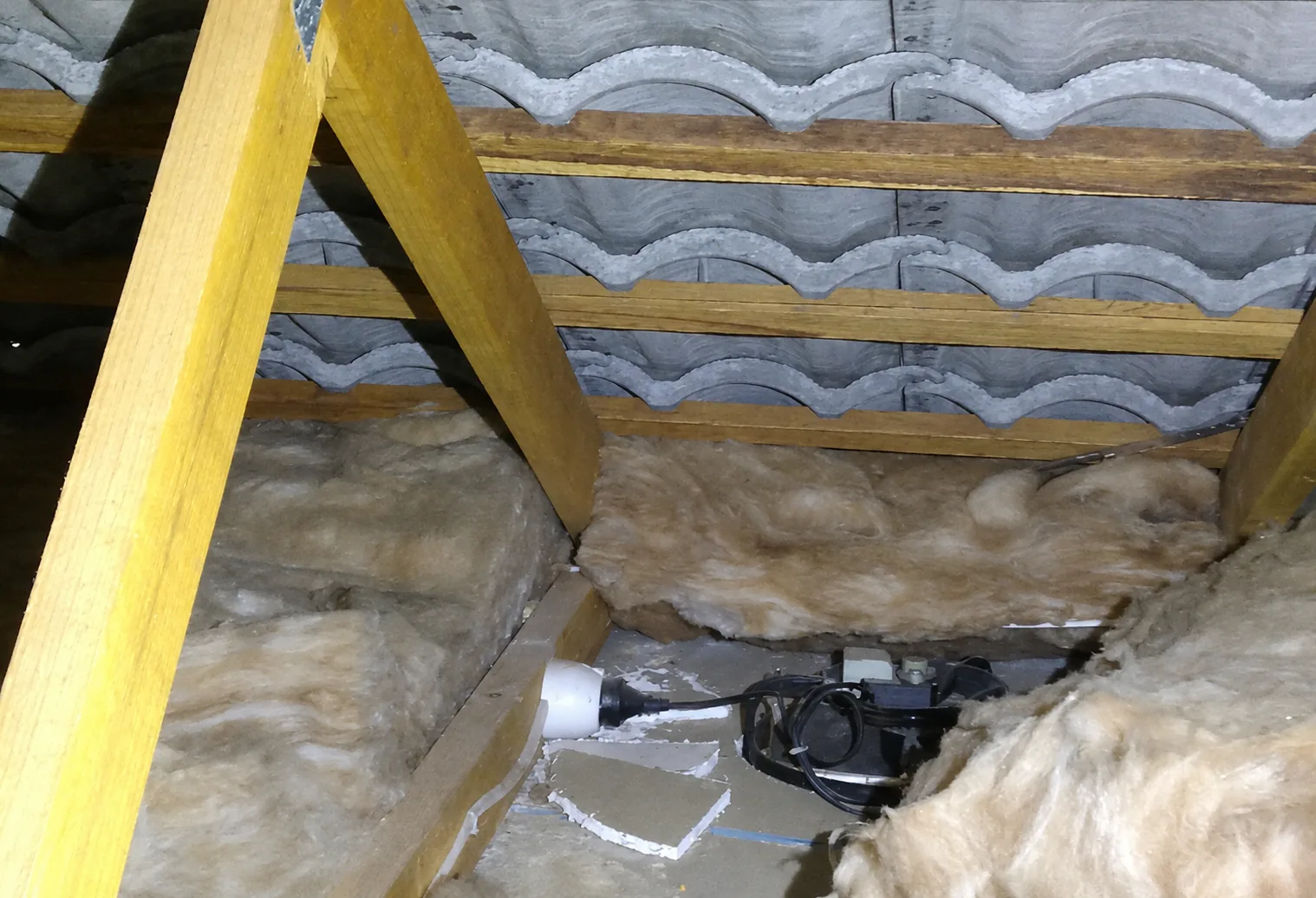 Bathroom extractor fan ducting discharging into roof space during an Auckland inspection